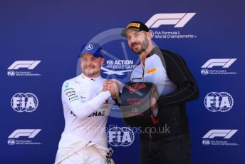 World © Octane Photographic Ltd. Formula 1 – Spanish GP. Qualifying. Mercedes AMG Petronas Motorsport AMG F1 W10 EQ Power+ - Valtteri Bottas receive the Pirelli Pole Position Award from the Pirelli Representative, WWE Star Cesaro. Circuit de Barcelona Catalunya, Spain. Saturday 11th May 2019.