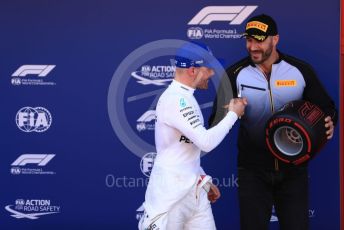 World © Octane Photographic Ltd. Formula 1 – Spanish GP. Qualifying. Mercedes AMG Petronas Motorsport AMG F1 W10 EQ Power+ - Valtteri Bottas receive the Pirelli Pole Position Award from the Pirelli Representative, WWE Star Cesaro. Circuit de Barcelona Catalunya, Spain. Saturday 11th May 2019.