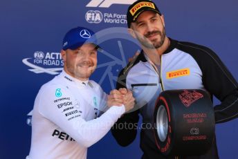 World © Octane Photographic Ltd. Formula 1 – Spanish GP. Qualifying. Mercedes AMG Petronas Motorsport AMG F1 W10 EQ Power+ - Valtteri Bottas receive the Pirelli Pole Position Award from the Pirelli Representative, WWE Star Cesaro. Circuit de Barcelona Catalunya, Spain. Saturday 11th May 2019.