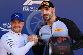 World © Octane Photographic Ltd. Formula 1 – Spanish GP. Qualifying. Mercedes AMG Petronas Motorsport AMG F1 W10 EQ Power+ - Valtteri Bottas receive the Pirelli Pole Position Award from the Pirelli Representative, WWE Star Cesaro. Circuit de Barcelona Catalunya, Spain. Saturday 11th May 2019.