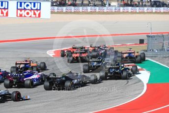 World © Octane Photographic Ltd. Formula 1 – United States GP - Race. Mercedes AMG Petronas Motorsport AMG F1 W10 EQ Power+ - Valtteri Bottas leads the pack as McLaren MCL34 – Carlos Sainz runs wide. Circuit of the Americas (COTA), Austin, Texas, USA. Sunday 3rd November 2019.
