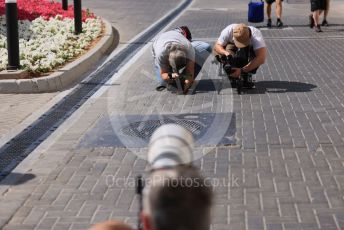 World © Octane Photographic Ltd. Formula 1 – Etihad F1 Grand Prix Abu Dhabi. TV crews taking video of the photographers. Yas Marina Circuit, Abu Dhabi. Thursday 9th December 2021 Paddock.