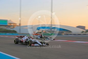 World © Octane Photographic Ltd. Formula 1 – Etihad F1 Grand Prix Abu Dhabi. Alfa Romeo Racing Orlen C41 – Antonio Giovinazzi.  and Mercedes AMG Petronas F1 Team F1 W12 - Lewis Hamilton. Yas Marina Circuit, Abu Dhabi. Friday 10th December 2021 Practice 2.