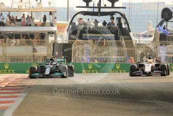World © Octane Photographic Ltd. Formula 1 – Etihad F1 Grand Prix Abu Dhabi. Mercedes AMG Petronas F1 Team F1 W12 - Valtteri Bottas and Uralkali Haas F1 Team VF21 – Nikita Mazepin. Yas Marina Circuit, Abu Dhabi. Saturday 11th December 2021 Practice 3.