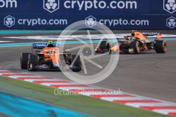 World © Octane Photographic Ltd. Formula 1 – Etihad F1 Grand Prix Abu Dhabi. McLaren F1 Team MCL35M – Lando Norris and Red Bull Racing Honda RB16B – Sergio Perez. Yas Marina Circuit, Abu Dhabi. Sunday 12th December 2021 Green Flag Lap.