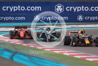 World © Octane Photographic Ltd. Formula 1 – Etihad F1 Grand Prix Abu Dhabi. Red Bull Racing Honda RB16B – Sergio Perez, Scuderia Ferrari Mission Winnow SF21 – Carlos Sainz and Mercedes AMG Petronas F1 Team F1 W12 - Valtteri Bottas. Yas Marina Circuit, Abu Dhabi. Sunday 12th December 2021 Green Flag Lap.
