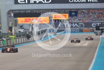 World © Octane Photographic Ltd. Formula 1 – Etihad F1 Grand Prix Abu Dhabi. Scuderia Ferrari Mission Winnow SF21 – Carlos Sainz and McLaren F1 Team MCL35M – Lando Norris. Yas Marina Circuit, Abu Dhabi. Sunday 12th December 2021 Race.