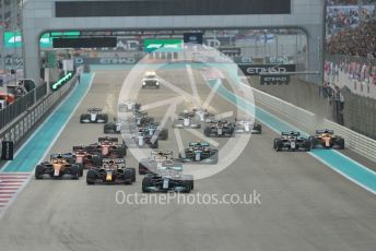 World © Octane Photographic Ltd. Formula 1 – Etihad F1 Grand Prix Abu Dhabi. Mercedes AMG Petronas F1 Team F1 W12 - Lewis Hamilton leads the Red Bull Racing Honda RB16B of Max Verstappen away from the line at race start. Yas Marina Circuit, Abu Dhabi. Sunday 12th December 2021 Race.