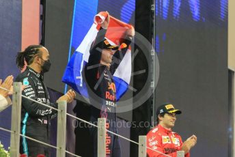 World © Octane Photographic Ltd. Formula 1 – Etihad F1 Grand Prix Abu Dhabi. Red Bull Racing Honda RB16B – Max Verstappen, Mercedes AMG Petronas F1 Team F1 W12 - Lewis Hamilton and Scuderia Ferrari Mission Winnow SF21 – Carlos Sainz. Yas Marina Circuit, Abu Dhabi. Sunday 12th December 2021 Podium and post race celebrations.
