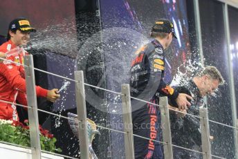 World © Octane Photographic Ltd. Formula 1 – Etihad F1 Grand Prix Abu Dhabi. Red Bull Racing Honda RB16B – Max Verstappen and Christian Horner - Team Principal of Red Bull Racing with Scuderia Ferrari Mission Winnow SF21 – Carlos Sainz. Yas Marina Circuit, Abu Dhabi. Sunday 12th December 2021 Podium and post race celebrations.