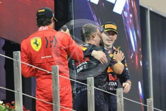 World © Octane Photographic Ltd. Formula 1 – Etihad F1 Grand Prix Abu Dhabi. Red Bull Racing Honda RB16B – Max Verstappen and Christian Horner - Team Principal of Red Bull Racing with Scuderia Ferrari Mission Winnow SF21 – Carlos Sainz. Yas Marina Circuit, Abu Dhabi. Sunday 12th December 2021 Podium and post race celebrations.