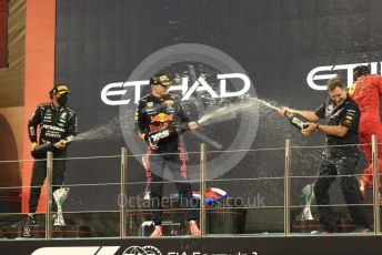 World © Octane Photographic Ltd. Formula 1 – Etihad F1 Grand Prix Abu Dhabi. Red Bull Racing Honda RB16B – Max Verstappen and Christian Horner - Team Principal of Red Bull Racing with Mercedes AMG Petronas F1 Team F1 W12 - Lewis Hamilton. Yas Marina Circuit, Abu Dhabi. Sunday 12th December 2021 Podium and post race celebrations.