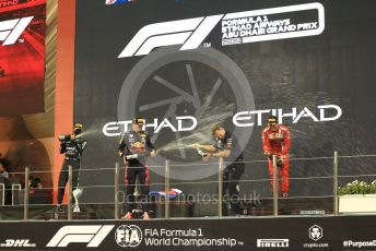 World © Octane Photographic Ltd. Formula 1 – Etihad F1 Grand Prix Abu Dhabi. Red Bull Racing Honda RB16B – Max Verstappen and Christian Horner - Team Principal of Red Bull Racing with Mercedes AMG Petronas F1 Team F1 W12 - Lewis Hamilton and Scuderia Ferrari Mission Winnow SF21 – Carlos Sainz. Yas Marina Circuit, Abu Dhabi. Sunday 12th December 2021 Podium and post race celebrations.