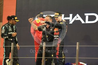 World © Octane Photographic Ltd. Formula 1 – Etihad F1 Grand Prix Abu Dhabi. Red Bull Racing Honda RB16B – Max Verstappen and Christian Horner - Team Principal of Red Bull Racing with Mercedes AMG Petronas F1 Team F1 W12 - Lewis Hamilton. Yas Marina Circuit, Abu Dhabi. Sunday 12th December 2021 Podium and post race celebrations.