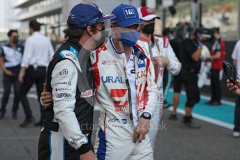 World © Octane Photographic Ltd. Formula 1 – Etihad F1 Grand Prix Abu Dhabi. Alpine F1 Team A521 – Fernando Alonso and Uralkali Haas F1 Team VF21 – Mick Schumacher. Yas Marina Circuit, Abu Dhabi. Sunday 12th December 2021 Drivers’ Parade.