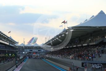 World © Octane Photographic Ltd. Formula 1 – Etihad F1 Grand Prix Abu Dhabi. A6-BMH Etihad Boeing 787-10 Dreamliner in their "Greenliner" livery in formation with the 7 Al Fursan Aermacchi MB-339As overfly the grid.