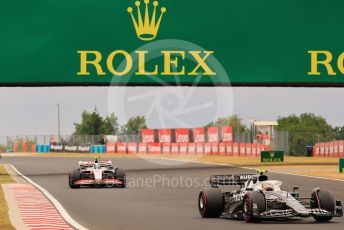 World © Octane Photographic Ltd. Formula 1– Hungarian Grand Prix - Hungaroring, Hungary. Sunday 31st July 2022 Race out laps. Scuderia AlphaTauri AT03 - Yuki Tsunoda and Haas F1 Team VF-22 - Mick Schumacher..
