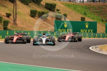World © Octane Photographic Ltd. Formula 1– Hungarian Grand Prix - Hungaroring, Hungary. Sunday 31st July 2022 Race Green Flag lap. Mercedes-AMG Petronas F1 Team F1 W13 - George Russell leads Scuderia Ferrari F1-75 - Carlos Sainz and Charles Leclerc.