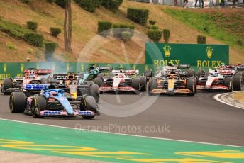 World © Octane Photographic Ltd. Formula 1– Hungarian Grand Prix - Hungaroring, Hungary. Sunday 31st July 2022 Race. BWT Alpine F1 Team A522 - Fernando Alonso and Oracle Red Bull Racing RB18 – Max Verstappen. Alfa Romeo F1 Team Orlen C42 - Valtteri Bottas locks a wheel.