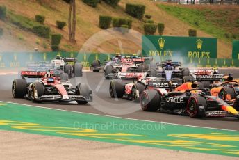 World © Octane Photographic Ltd. Formula 1– Hungarian Grand Prix - Hungaroring, Hungary. Sunday 31st July 2022 Race. Alfa Romeo F1 Team Orlen C42 - Valtteri Bottas and Williams Racing FW44 - Alex Albon both lock a wheel.