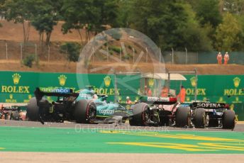 World © Octane Photographic Ltd. Formula 1– Hungarian Grand Prix - Hungaroring, Hungary. Sunday 31st July 2022 Race. Debris follows the pack into Turn 2 from collisions.