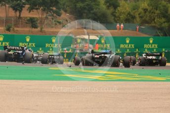 World © Octane Photographic Ltd. Formula 1– Hungarian Grand Prix - Hungaroring, Hungary. Sunday 31st July 2022 Race. Debris follows the pack into Turn 2 from collisions.