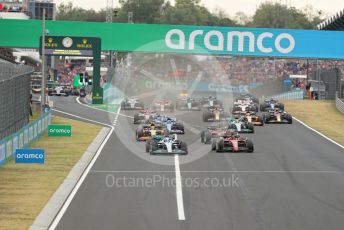 World © Octane Photographic Ltd. Formula 1– Hungarian Grand Prix - Hungaroring, Hungary. Sunday 31st July 2022 Race. Mercedes-AMG Petronas F1 Team F1 W13 - George Russell and Scuderia Ferrari F1-75 - Carlos Sainz lead the pack.