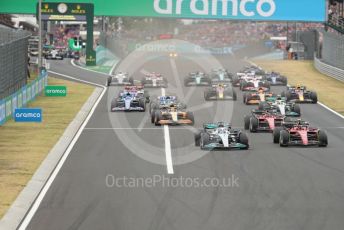 World © Octane Photographic Ltd. Formula 1– Hungarian Grand Prix - Hungaroring, Hungary. Sunday 31st July 2022 Race. Mercedes-AMG Petronas F1 Team F1 W13 - George Russell and Scuderia Ferrari F1-75 - Carlos Sainz lead the pack.