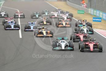 World © Octane Photographic Ltd. Formula 1– Hungarian Grand Prix - Hungaroring, Hungary. Sunday 31st July 2022 Race. Mercedes-AMG Petronas F1 Team F1 W13 - George Russell and Scuderia Ferrari F1-75 - Carlos Sainz lead the pack.