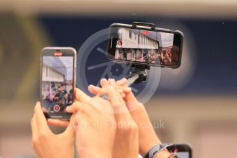 World © Octane Photographic Ltd. Formula 1– Hungarian Grand Prix - Hungaroring, Hungary. Sunday 31st July 2022 Parc Ferme. Oracle Red Bull Racing RB18 – Max Verstappen in a fan's mobile phone