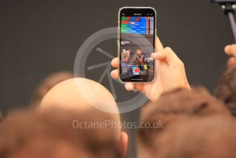 World © Octane Photographic Ltd. Formula 1– Hungarian Grand Prix - Hungaroring, Hungary. Sunday 31st July 2022 Parc Ferme. Oracle Red Bull Racing RB18 – Max Verstappen in a fan's mobile phone.
