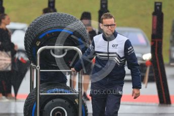 World © Octane Photographic Ltd. Formula 1 – Japanese Grand Prix - Suzuka Circuit, Japan. Friday 7th October 2022. Paddock. Scuderia AlphaTauri mechanic with Pirelli wet tyres.