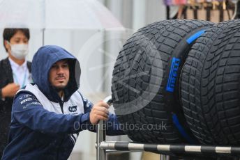 World © Octane Photographic Ltd. Formula 1 – Japanese Grand Prix - Suzuka Circuit, Japan. Friday 7th October 2022. Paddock. Scuderia AlphaTauri mechanic with Pirelli wet tyres.