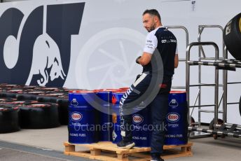 World © Octane Photographic Ltd. Formula 1 – Japanese Grand Prix - Suzuka Circuit, Japan. Thursday 6th October 2022. Arrivals. Scuderia AlphaTauri mechanic with Esso race fuel.