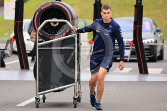 World © Octane Photographic Ltd. Formula 1 – Japanese Grand Prix - Suzuka Circuit, Japan. Thursday 6th October 2022. Arrivals.  Williams Racing mechanic with Pirelli soft tyres