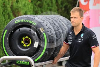 World © Octane Photographic Ltd. Formula 1 – Japanese Grand Prix - Suzuka Circuit, Japan. Thursday 6th October 2022. Arrivals. Mercedes-AMG Petronas F1 Team mechanic with Pirelli intermediate tyres.