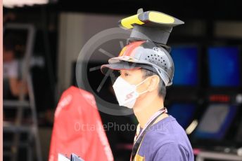 World © Octane Photographic Ltd. Formula 1 – Japanese Grand Prix - Suzuka Circuit, Japan. Thursday 6th October 2022. Paddock. Fan with Ferrari Sainz camera hat.