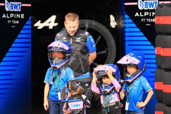 World © Octane Photographic Ltd. Formula 1 – Japanese Grand Prix - Suzuka Circuit, Japan. Thursday 6th October 2022. Pitlane. BWT Alpine F1 Team guests with their children wearing mechanics' helmets.