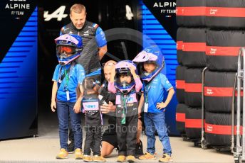World © Octane Photographic Ltd. Formula 1 – Japanese Grand Prix - Suzuka Circuit, Japan. Thursday 6th October 2022. Pitlane. BWT Alpine F1 Team guests with their children wearing mechanics' helmets.