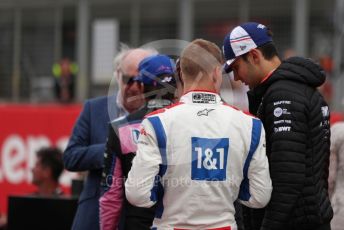 World © Octane Photographic Ltd. Formula 1 – British Grand Prix - Silverstone. Sunday 3rd July 2022. Grid. BWT Alpine F1 Team A522 - Esteban Ocon and Haas F1 Team VF-22 - Mick Schumacher.