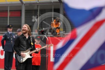 World © Octane Photographic Ltd. Formula 1 – British Grand Prix - Silverstone. Sunday 3rd July 2022. Grid. Sam Ryder (UK Eurovision 2022 entry) sings the national anthem.