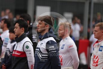 World © Octane Photographic Ltd. Formula 1 – British Grand Prix - Silverstone. Sunday 3rd July 2022. Grid. Alfa Romeo F1 Team Orlen C42 - Guanyu Zhou, Scuderia AlphaTauri AT03 - Pierre Gasly, Haas F1 Team VF-22 - Mick Schumacher and Kevin Magnussen,