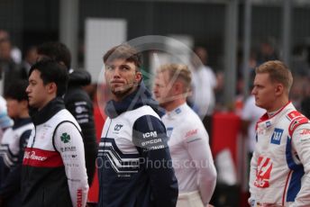 World © Octane Photographic Ltd. Formula 1 – British Grand Prix - Silverstone. Sunday 3rd July 2022. Grid. Alfa Romeo F1 Team Orlen C42 - Guanyu Zhou, Scuderia AlphaTauri AT03 - Pierre Gasly, Haas F1 Team VF-22 - Mick Schumacher and Kevin Magnussen,