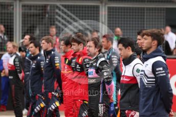 World © Octane Photographic Ltd. Formula 1 – British Grand Prix - Silverstone. Sunday 3rd July 2022. Grid. Oracle Red Bull Racing RB18 – Max Verstappen and Sergio Perez, World © Octane Photographic Ltd. Formula 1 – British Grand Prix - Silverstone. Sunday 3rd July 2022. Paddock. Scuderia Ferrari F1-75 - Charles Leclerc and Carlos Sainz ,  BWT Alpine F1 Team A522 - Fernando Alonso, Alfa Romeo F1 Team Orlen C42 - Guanyu Zhou and Scuderia AlphaTauri AT03 - Pierre Gasly.