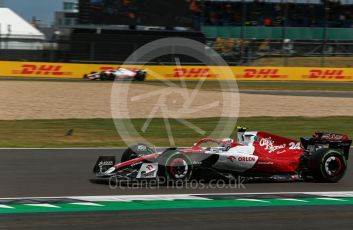 World © Octane Photographic Ltd. Formula 1 – British Grand Prix - Silverstone. Friday 1st July 2022. Practice 1. Alfa Romeo F1 Team Orlen C42 - Guanyu Zhou and Haas F1 Team VF-22 - Kevin Magnussen.
