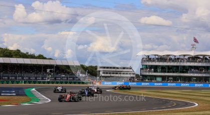 World © Octane Photographic Ltd. Formula 1 – British Grand Prix - Silverstone. Friday 1st July 2022. Practice 2. Scuderia Ferrari F1-75 - Carlos Sainz and Williams Racing FW44 - Nicholas Latifi.