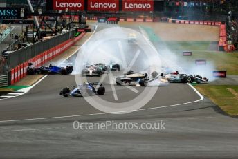 World © Octane Photographic Ltd. Formula 1 – British Grand Prix - Silverstone. Sunday 3rd July 2022. Race. Alfa Romeo F1 Team Orlen C42 - Guanyu Zhou slides inverted towards the gravel trap and barrier as Williams Racing FW44 - Alex Albon impacts the pit wall and Mercedes-AMG Petronas F1 Team F1 W13 - George Russell also slides onto the grass after the collison.