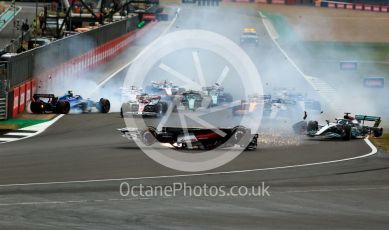 World © Octane Photographic Ltd. Formula 1 – British Grand Prix - Silverstone. Sunday 3rd July 2022. Race. Alfa Romeo F1 Team Orlen C42 - Guanyu Zhou slides inverted towards the gravel trap and barrier as Williams Racing FW44 - Alex Albon impacts the pit wall and Mercedes-AMG Petronas F1 Team F1 W13 - George Russell also slides onto the grass after the collison.