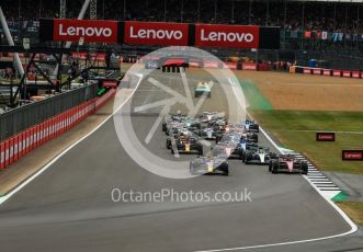 World © Octane Photographic Ltd. Formula 1 – British Grand Prix - Silverstone. Sunday 3rd July 2022. Race. Oracle Red Bull Racing RB18 – Max Verstappen and Scuderia Ferrari F1-75 - Carlos Sainz head the pack with Mercedes-AMG Petronas F1 Team F1 W13 - Lewis Hamilton and Scuderia Ferrari F1-75 - Charles Leclerc behind.