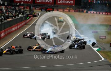 World © Octane Photographic Ltd. Formula 1 – British Grand Prix - Silverstone. Sunday 3rd July 2022. Race. The Alfa Romeo F1 Team Orlen C42 of Guanyu Zhou is launched by the Mercedes-AMG Petronas F1 Team F1 W13 of George Russell as the Williams Racing FW44 of Alex Albon and the Aston Martin Aramco Cognizant F1 Team AMR22 of Lance Stroll come into contact.